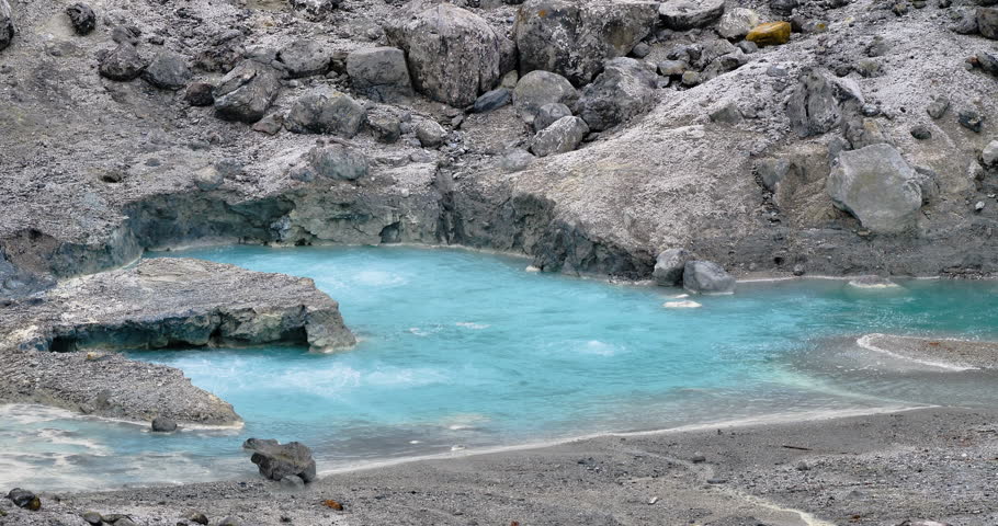 high-temperature sulfur springs gush forth at active volcano.