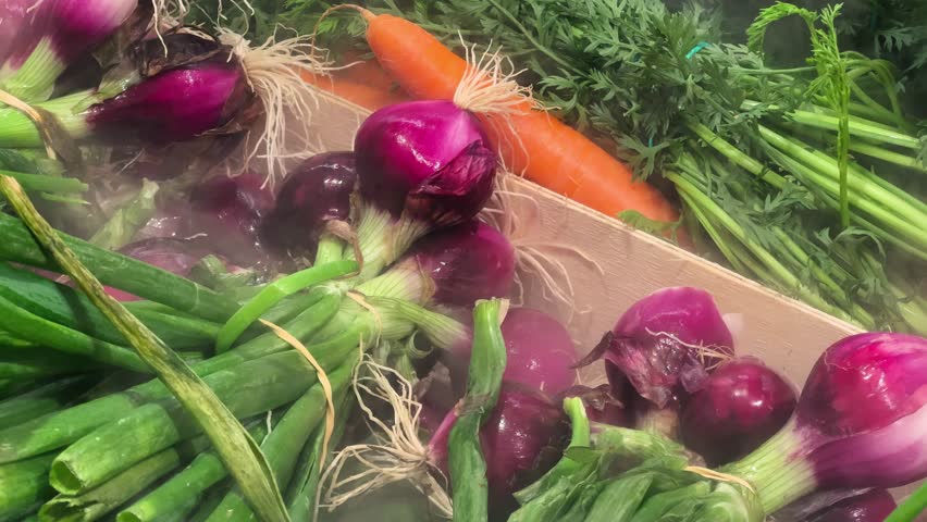 Set of vegetables, red onion and carrot in a food eco market with a steam refrigeration and humidification system.