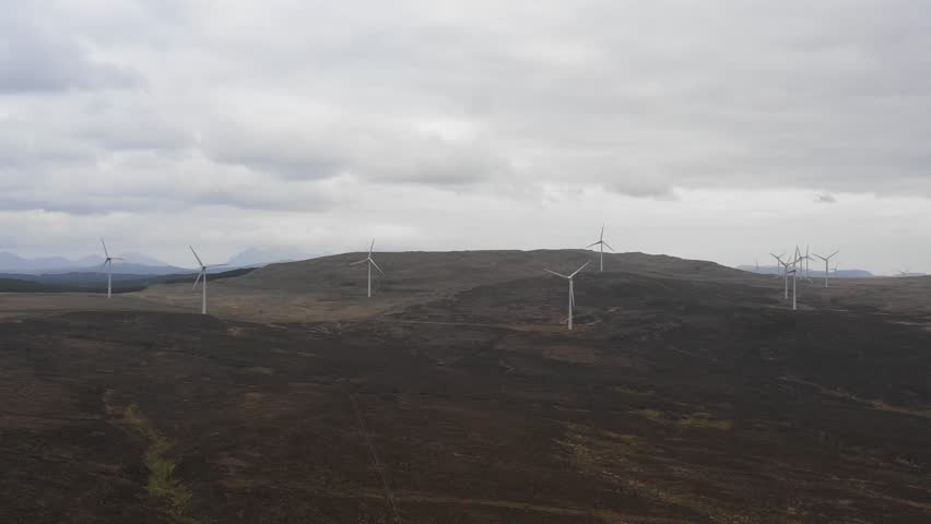 Wind farm in Scotland with turbines for electrical energy generation - Wind farm, power station for clean energy production from wind - Renewable energy and environment concepts