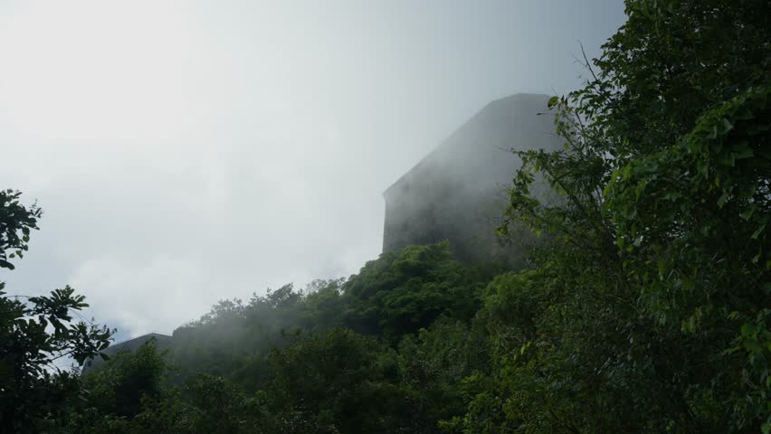 Citadelle Laferrière, shrouded in mist and fog, historic landmark in Haiti. Low-angle