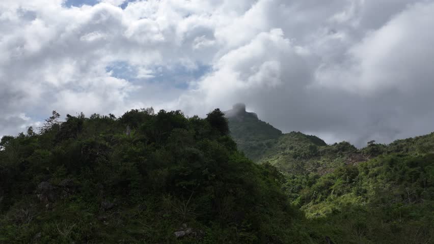 Citadelle Laferrière in clouds seen from valley, Haiti. Aerial drone view