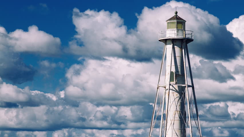 clouds rolling behing the lighthouse
