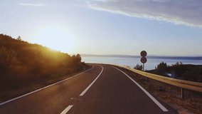 A dynamic aerial view of a busy city highway during rush hour, showcasing a river of car headlights and taillights creating light trails in the evening dusk. - Powered by Shutterstock - Get 15% off with code: PIKWIZARD15