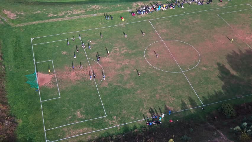 Aerial view Exciting Moment As Two Teams Of Teen Girls Compete In Soccer Match In Beechville Near Halifax Nova Scotia Canada. Parents Watch From The Field Edge.