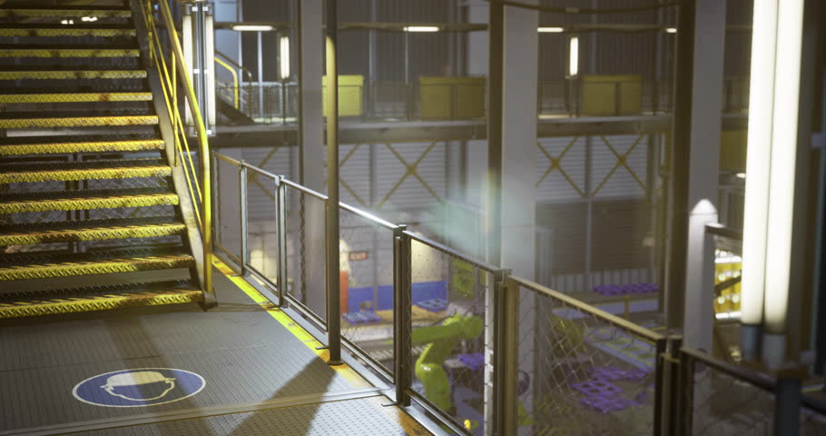 A spacious industrial facility showcases a stairway with yellow stripes, metal railings, and various equipment visible in the background. Bright lights shine throughout the area.