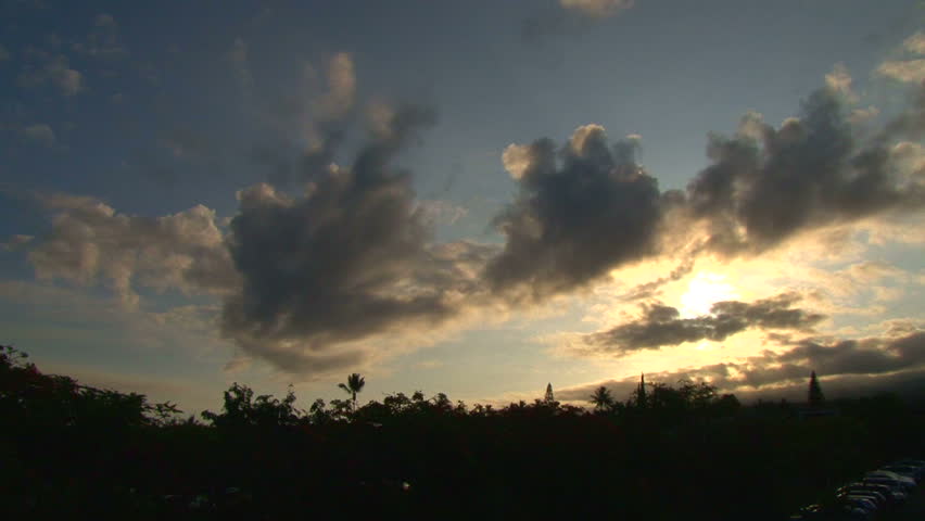 Hawaiian sunrise with building clouds time lapse.