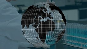 Researcher pipetting liquid into tubes while rotating wireframe globe showing laboratory research. Science, innovation, precision, experimentation, global, analysis, technology - Powered by Shutterstock - Get 15% off with code: PIKWIZARD15