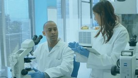 Team peering microscope and scrolling tablet in lab updating transparent data overlay for analysis. Science, collaboration, technology, innovation, exploration, research, digital - Powered by Shutterstock - Get 15% off with code: PIKWIZARD15