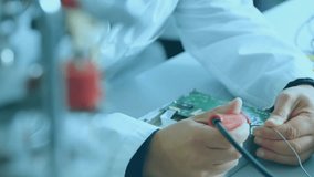 Mid adult male technician soldering circuit board in tech lab, map overlay growing hazard icons. Technology, electronics, innovation, engineering, cybersecurity, data, connectivity - Powered by Shutterstock - Get 15% off with code: PIKWIZARD15