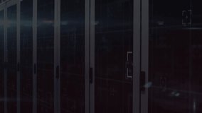 Binary code materializing before server cabinets, cascading downward, densifying to show data flow. Cybersecurity, data, technology, digital, network, industry, encryption - Powered by Shutterstock - Get 15% off with code: PIKWIZARD15