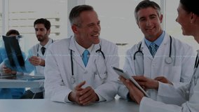 Female doctor showing tablet data while guiding analysis and peer raising X-ray for medical review. Collaboration, healthcare, diagnostics, technology, professionalism, consultation, teamwork - Powered by Shutterstock - Get 15% off with code: PIKWIZARD15