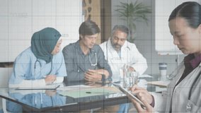 Doctor scrolling tablet and activating red graphs while medical team analyzing downward trends. Professional, teamwork, analysis, healthcare, modern, collaboration, data - Powered by Shutterstock - Get 15% off with code: PIKWIZARD15