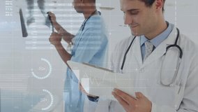 Clinician rotating chest X-ray film causing data charts appearing around doctor analyzing results. Healthcare, diagnostics, medical, analysis, technology, professional, teamwork - Powered by Shutterstock - Get 15% off with code: PIKWIZARD15