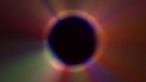 A vibrant, abstract image featuring a dark central area surrounded by a halo of colorful light. The colors blend and radiate outwards. - Powered by Shutterstock - Get 15% off with code: PIKWIZARD15