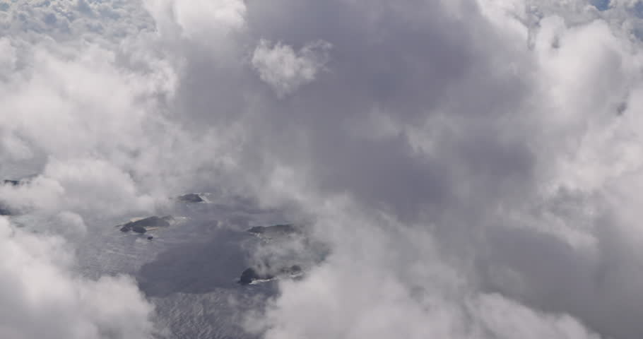 The vast clouds and the interweaving of light and shadows above the sea