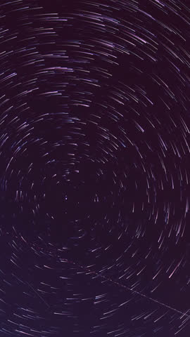 Time‑lapse of the Milky Way and moonrise over a majestic mountain landscape at night, revealing stars, galaxies and shifting light in a tranquil, awe‑inspiring natural scene.