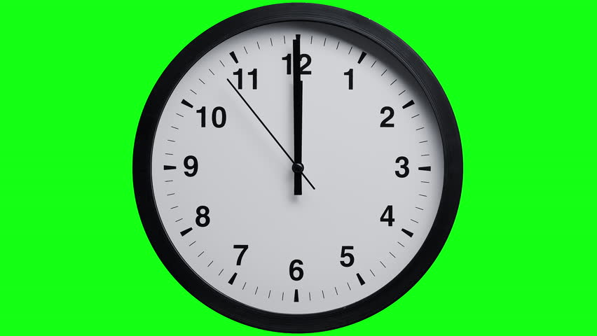 Time lapse video of a rotation of the hands of a classic black and white wall clock against a green screen chromakey background. A symbol of the transience of time and life