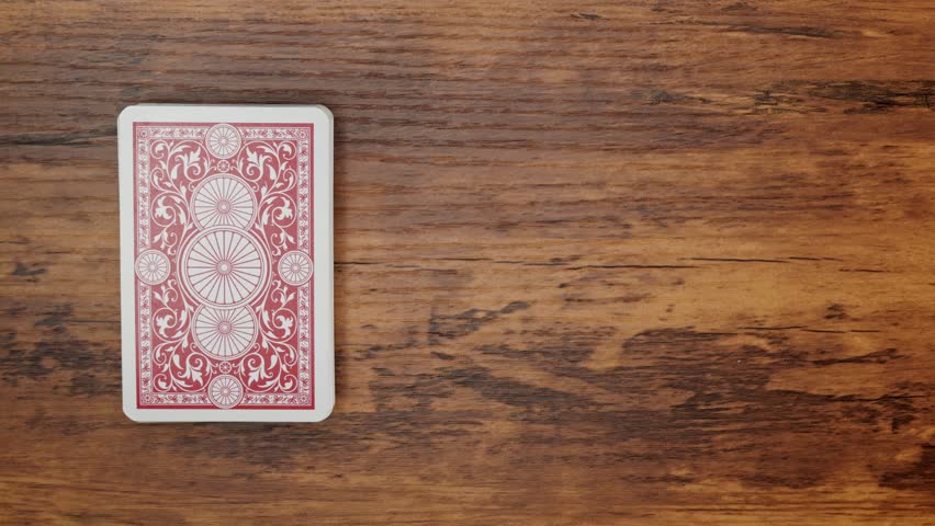 Top-Down View of Drawing the Ace of Clubs from a Deck of Cards