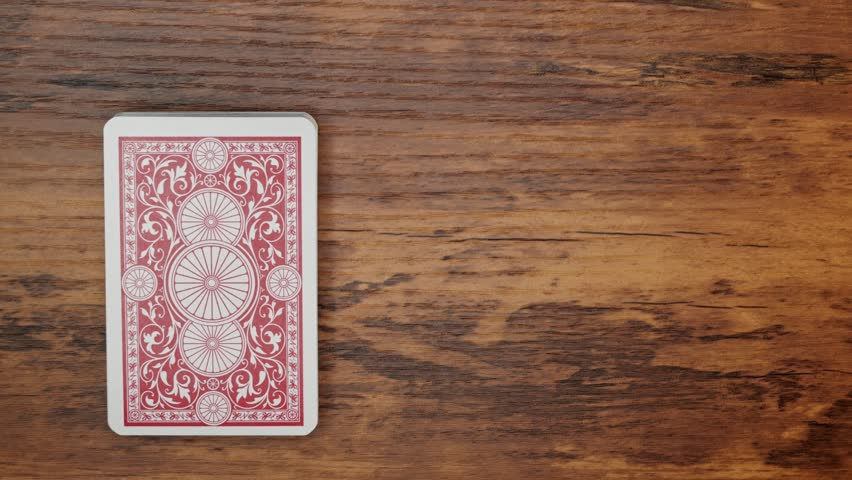 Top-Down View of Drawing the Ten of Clubs from a Deck of Cards