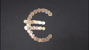 Stop motion with the Euro symbol made of coins gradually deconstructing and dispersing. - Powered by Shutterstock - Get 15% off with code: PIKWIZARD15