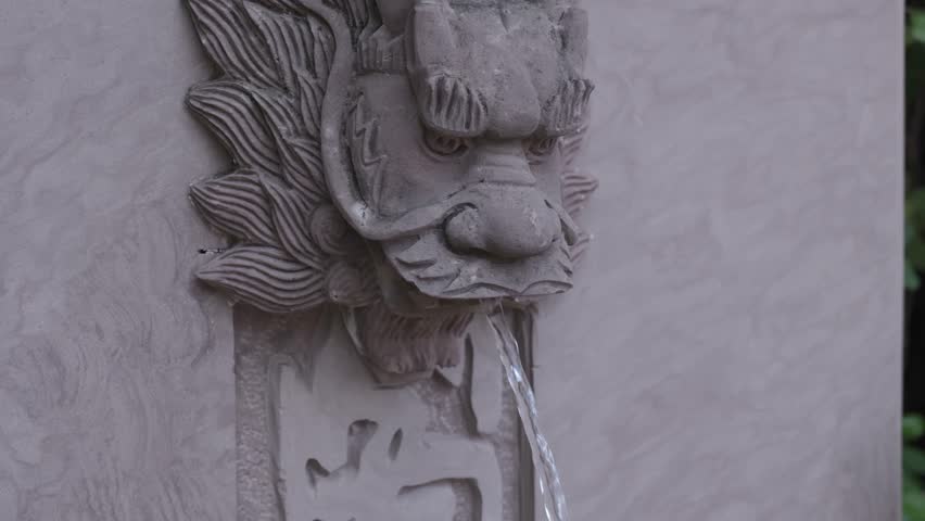 Fountain landscape: Stone dragon sculpture spouting water