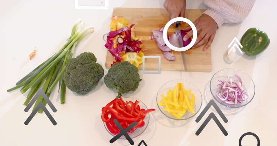 Woman's hands lifting red onion on cutting board, slicing strips into glass bowl for cooking. Vegetables, culinary, prep, minimalist, clean, healthy, ingredients