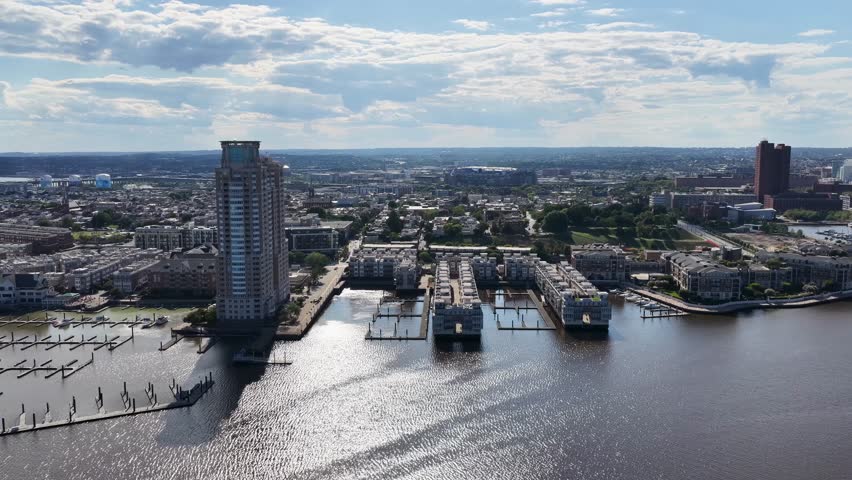 Baltimore Maryland USA - 8 25 2025: Aerial footage of skyscrapers and office buildings along the Patapsco River in Baltimore Maryland USA