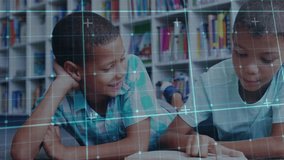 Two boys lying on carpet pointing at open book activating digital overlay and practicing reading. Children, education, collaboration, learning, literacy, library, teamwork - Powered by Shutterstock - Get 15% off with code: PIKWIZARD15