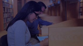 Academic researchers studying at library desks with data charts fading in and animating graphs. Collaboration, analytics, education, technology, focus, concentration, scholarly - Powered by Shutterstock - Get 15% off with code: PIKWIZARD15