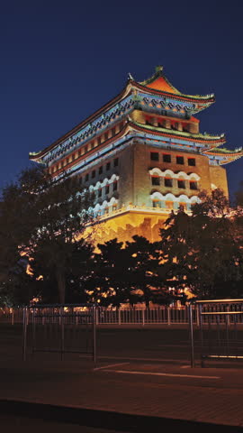 Beijing, China. Beijing Qianmen Street charming city street scene showcasing lively traffic and night lights. Yongdingmen Gate. Beijing Central Axis Tour Qianmen Street, Square