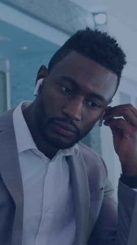 Animation of data processing and bitcoin symbols over african amercian businessman using laptop. global technology, connections and digital interface concept digitally generated video.