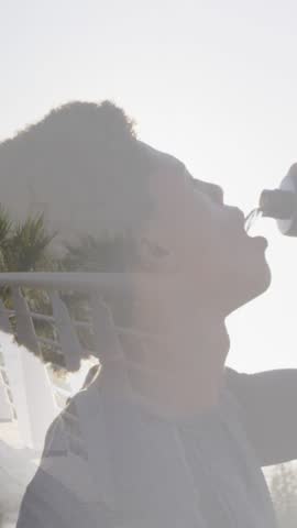 Animation of african amercian man running and drinking water. global sport and fitness concept digitally generated video.