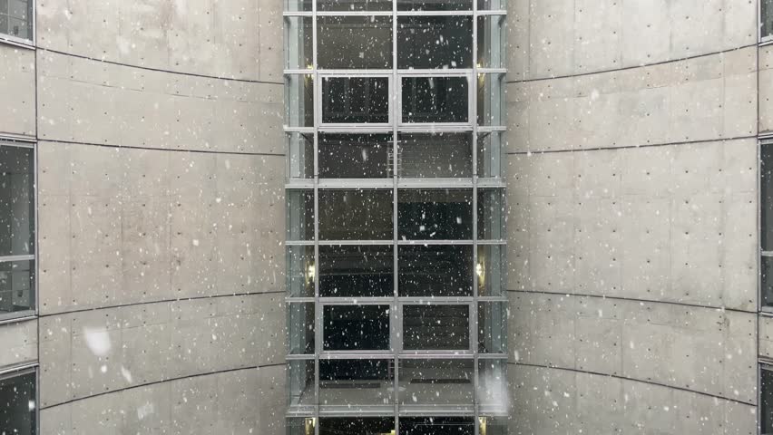 4K snow falling with building background and stairs
