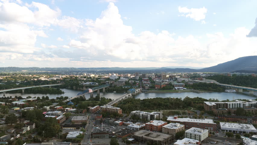 Drone view of Chattanooga’s skyline framed by the Tennessee River and Lookout Mountain, capturing the blend of city life and surrounding nature.
