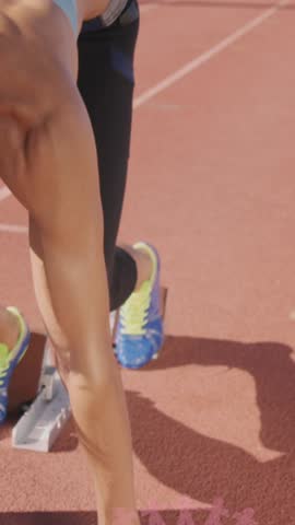 Animation of pink globe and people logos, floating over female runner on running track. breast cancer positive female health awareness campaign concept digitally generated video.