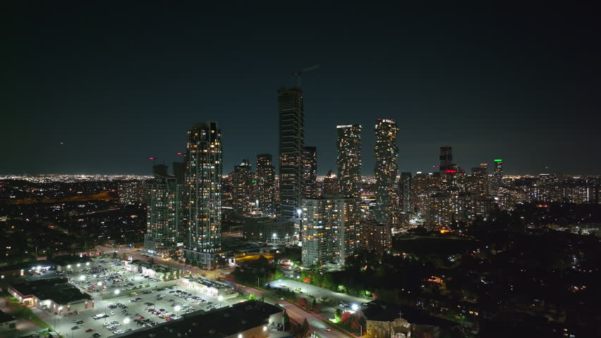 Night view of M City Condos in downtown Mississauga skyline