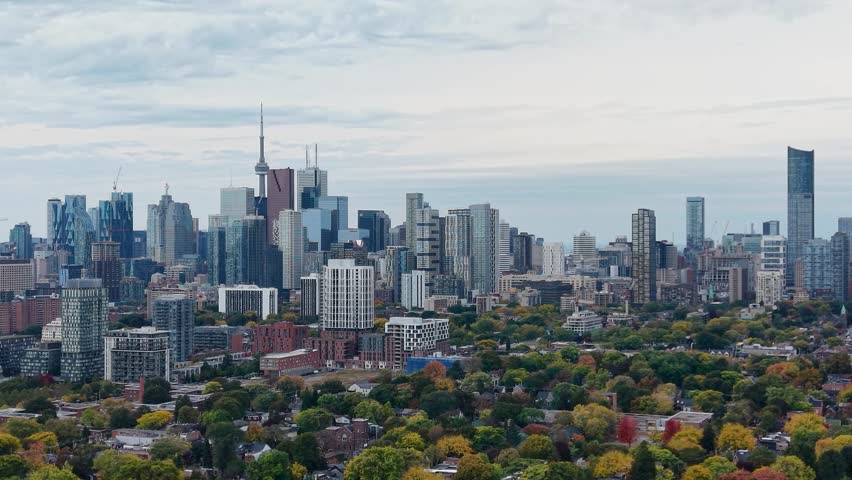 Beautiful drone view of the downtown Toronto skyline looking southwest in autumn, Ontario, Canada. Toronto architecture, CN Tower and skyscrapers.