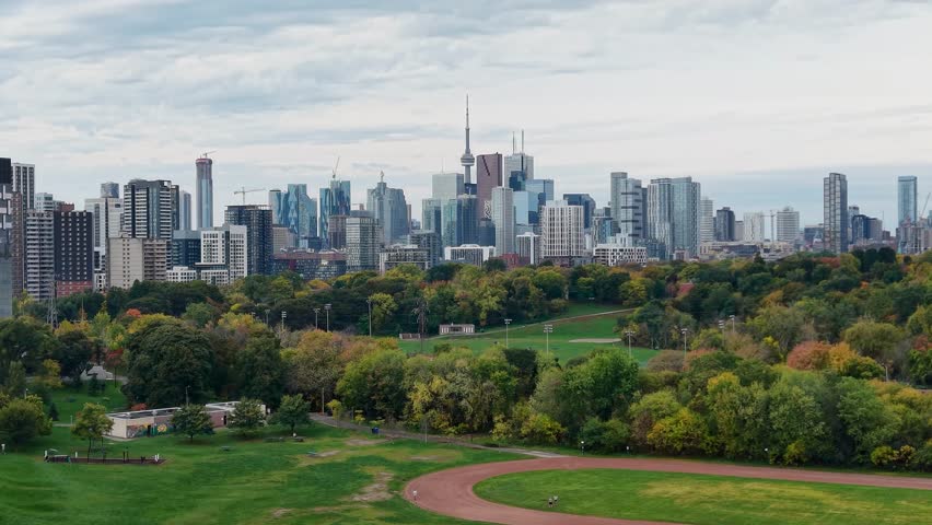 Beautiful drone view of the Riverdale Park and the downtown Toronto skyline looking southwest in autumn, Ontario, Canada. Toronto architecture, CN Tower and skyscrapers.