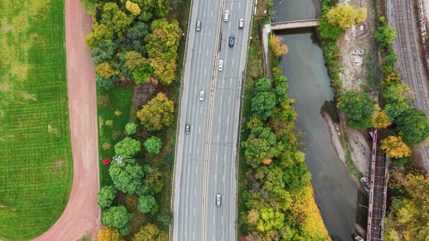 Beautiful drone view of the Don Valley Parkway, Riverdale Park and the Don River in autumn in Toronto, Ontario, Canada.