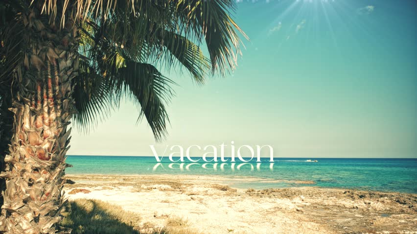 Time for a VACATION. High-quality stock video of a gorgeous beach where the animated word floats on the calm sea. Ideal for promoting hotels, tourist agencies, and summer getaways.