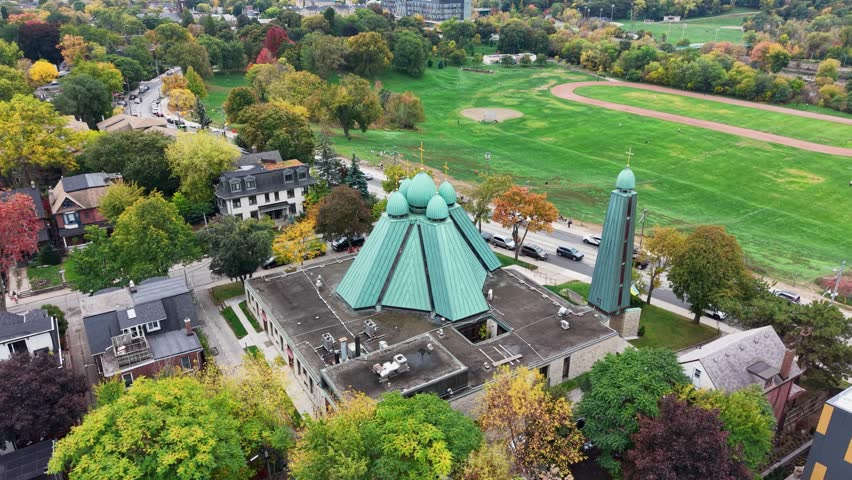 Panoramic drone view of the Holy Eucharist Ukrainian Catholic Church and residential buildings in the immediate vicinity of the church in autumn Toronto, Ontario, Canada.