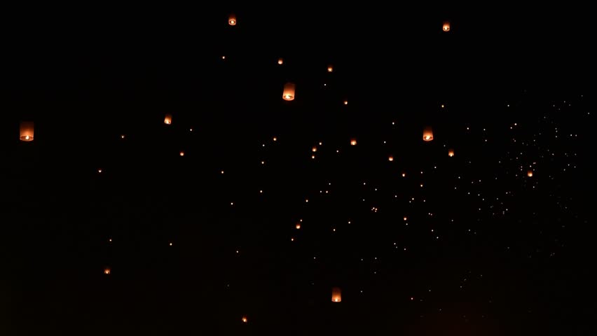 Lanna lantern releasing into dark sky celebrating Yipeng festival or Loi krathong in Chiangmai, Thailand