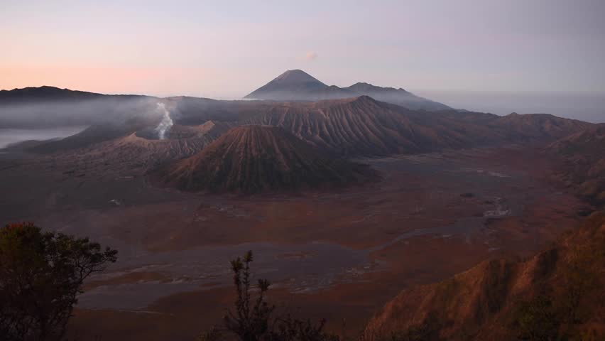 Watching the sunrise at Mount Bromo on Java Island, Indonesia, showcasing the breathtaking volcanic landscape and natural beauty of one of Indonesia’s most iconic travel destinations.