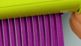 Close-up of Purple Paper Being Shredded with Paper Shredder on Blue Background in 4K Ultra HD — Office Document Destruction Concept Showing Paper Strips, Texture, and Business Security - Powered by Shutterstock - Get 15% off with code: PIKWIZARD15