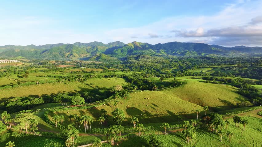 A stunning aerial view of the Caribbean coastline. Mountain peaks against the sky. Vibrant tropical landscape. Adventure travel concept. Panoramic view of the barren landscape.