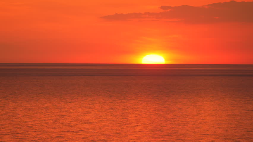 Sunset Over the Ocean with a Red Sky