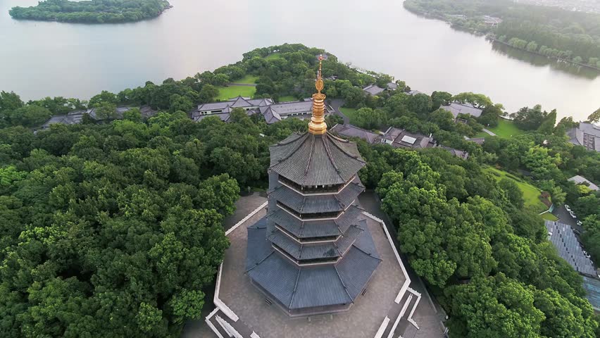 Leifeng Pagoda stands tall amidst lush greenery near West Lake in Hangzhou China