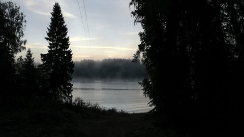 Aerial Drone Flight over Foggy River in Summer