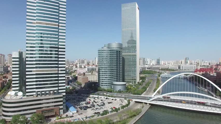 Tianjin cityscape featuring modern architecture and a bridge over the Hai River