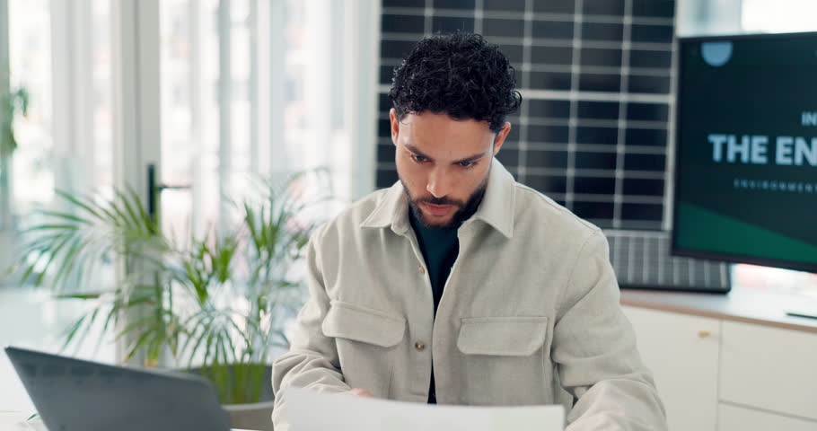 Laptop, paperwork and businessman in office with research for environment project with conservation. Documents, typing and male sustainability compliance officer with computer for forestry report.